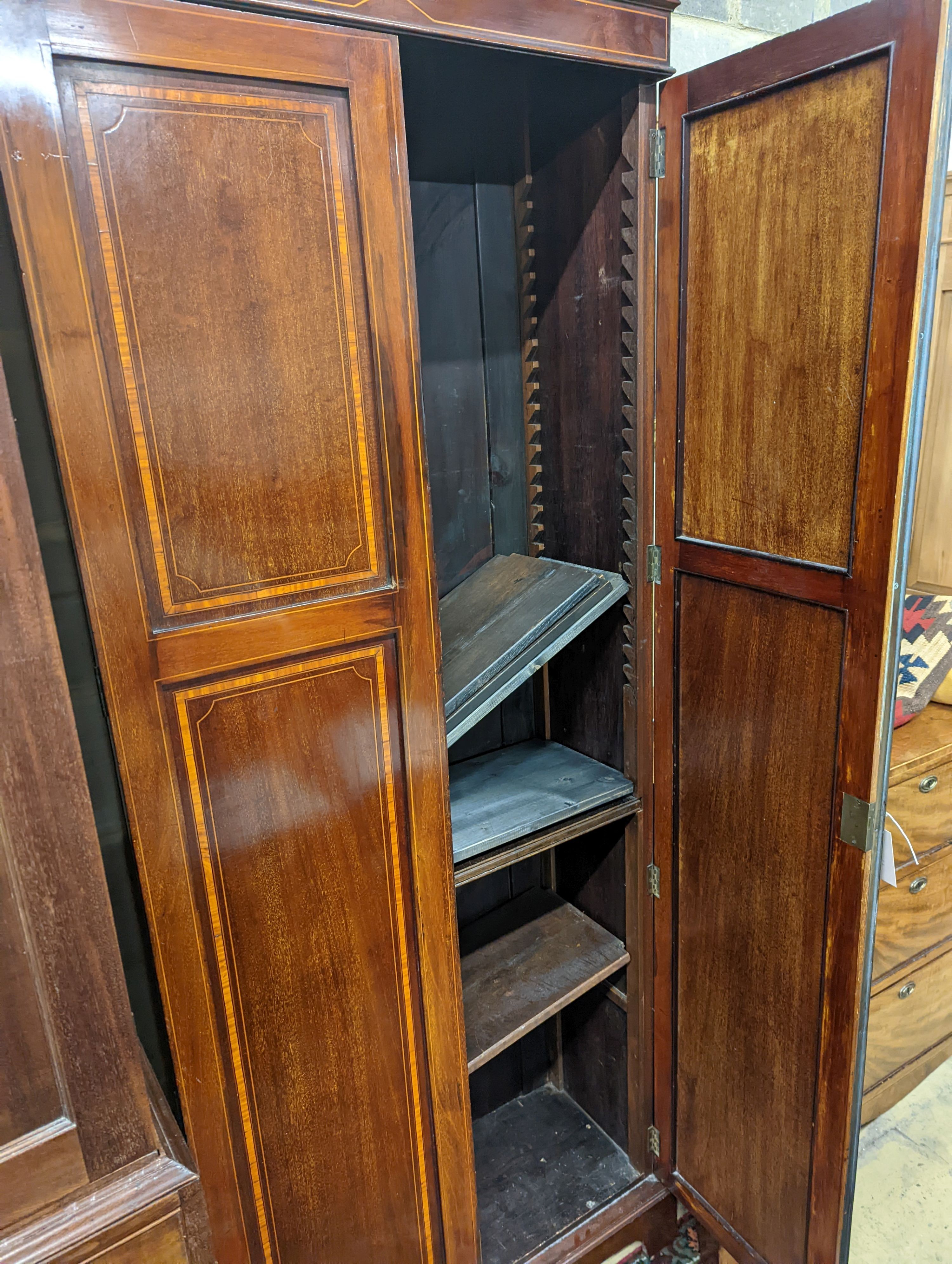 A Edwardian satinwood banded mahogany two door bookcase, width 83cm, depth 31cm, height 198cm